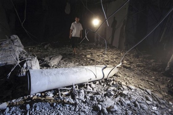 This photo distributed by China's Xinhua news agency shows the damage to the house of Libyan leader Moammar Gadhafi after a NATO airstrike during a tour organized by the Libyan government in the area of Gargur in Tripoli, Libya, early Sunday, May 1. Gadhafi escaped the NATO missile strike in Tripoli on Saturday, but his youngest son and three grandchildren under the age of 12 were killed, a government spokesman said.